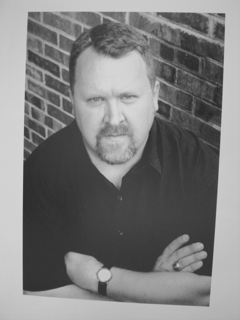 A professional photo of Scott C Holstad taken in Knoxville TN during 2003 photo shoots for his 2004 book, Cells. Used in articles published on Holstad in a variety of publications.